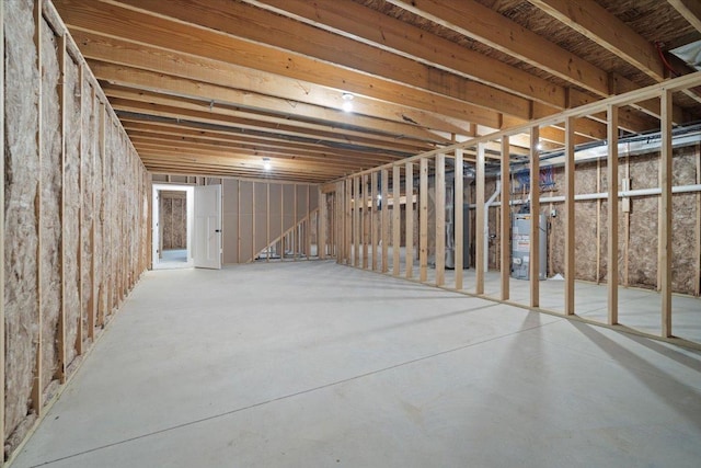 unfinished basement with gas water heater