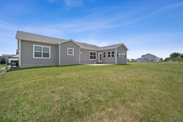 back of house featuring a lawn