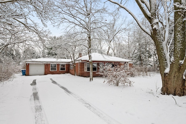 ranch-style home featuring a garage