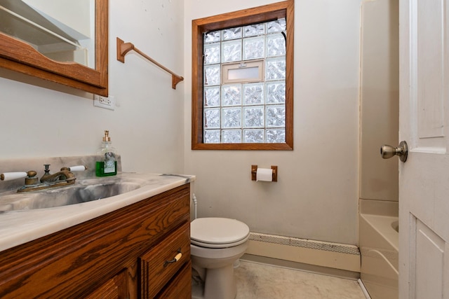 bathroom with baseboard heating, vanity, and toilet