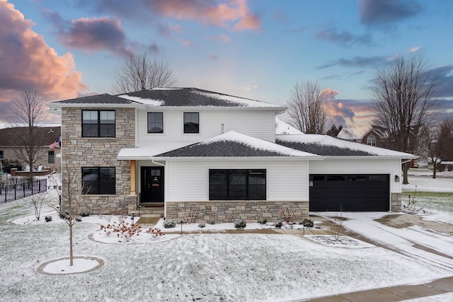 view of front of property with a garage