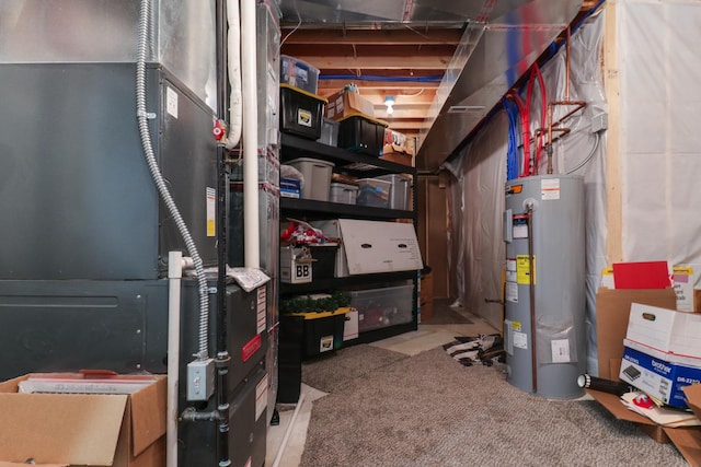 utility room featuring electric water heater and heating unit