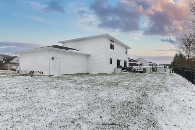 view of snowy exterior with central AC