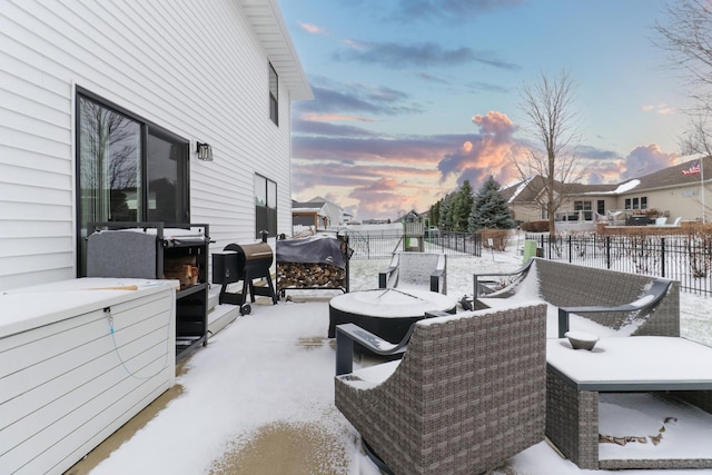 snow covered patio featuring outdoor lounge area