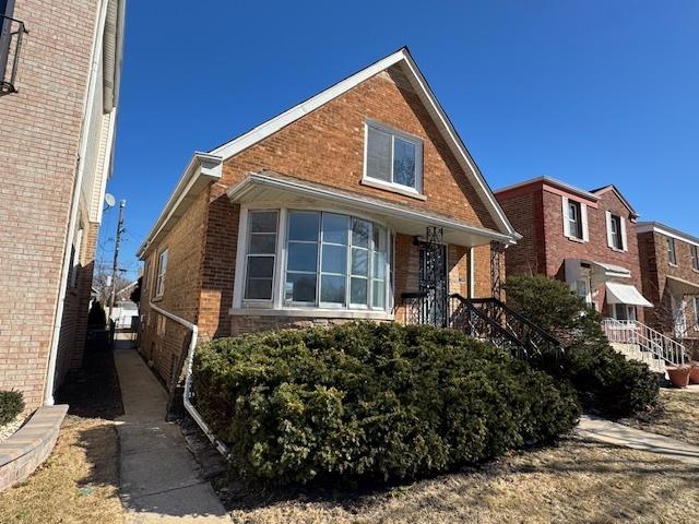 view of front of property with brick siding