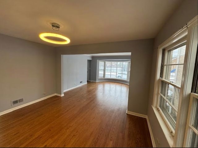 spare room with dark hardwood / wood-style floors