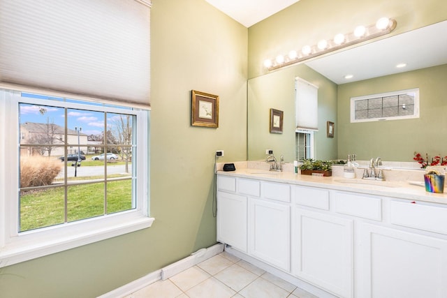 bathroom with tile patterned flooring and vanity