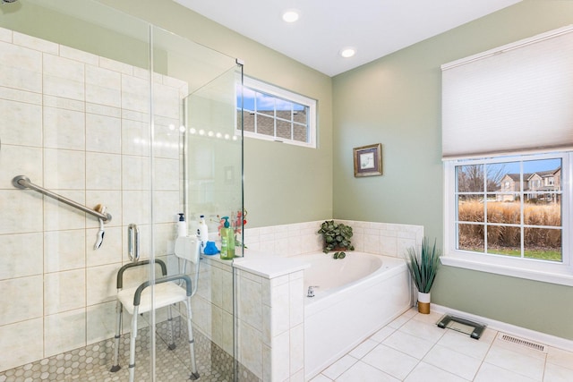 bathroom featuring tile patterned floors and separate shower and tub