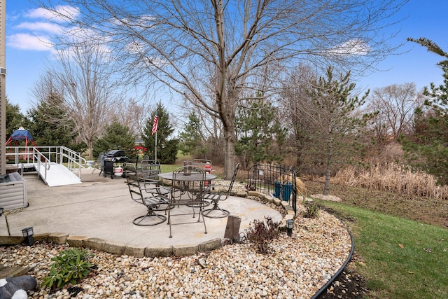 view of patio featuring a grill