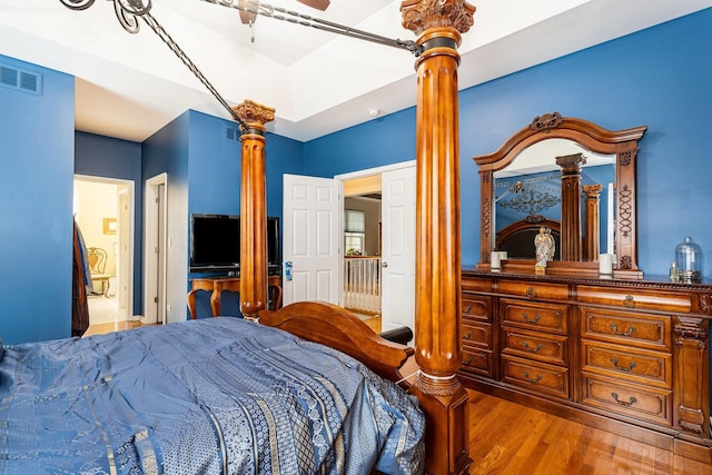 bedroom with ceiling fan and light wood-type flooring