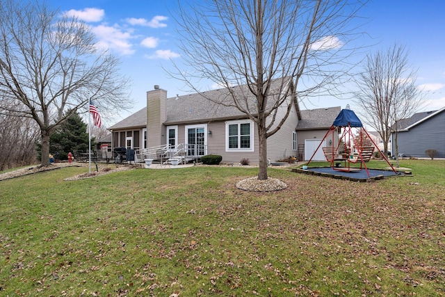 rear view of property with a patio area and a lawn