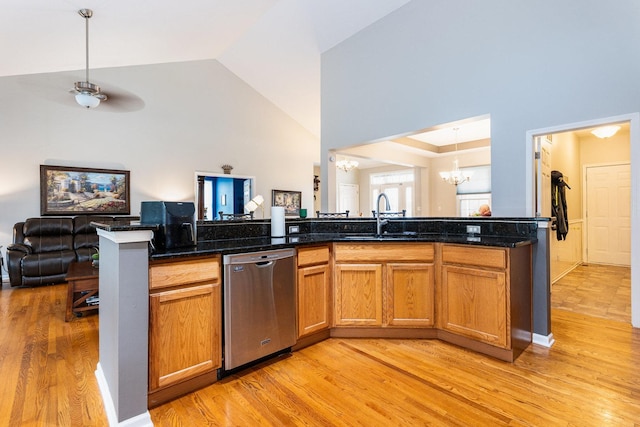 kitchen with dishwasher, sink, kitchen peninsula, light hardwood / wood-style floors, and ceiling fan with notable chandelier