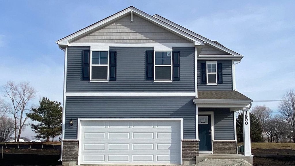 view of front of property featuring a garage