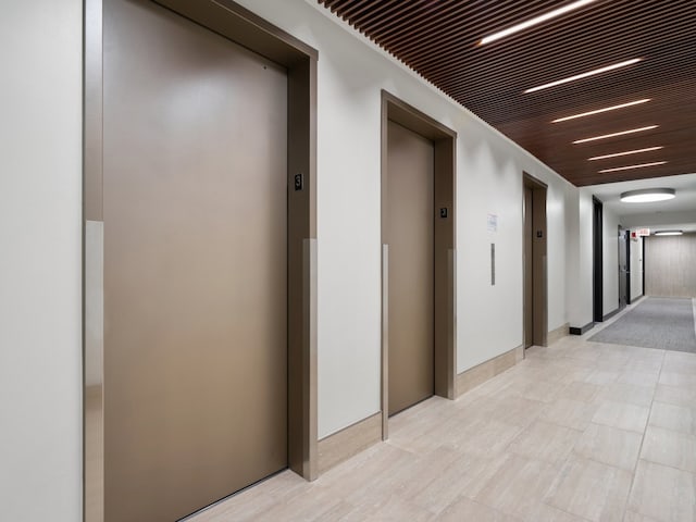 hallway featuring elevator