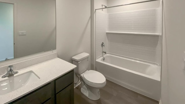 full bathroom featuring hardwood / wood-style floors, vanity, toilet, and shower / bathtub combination