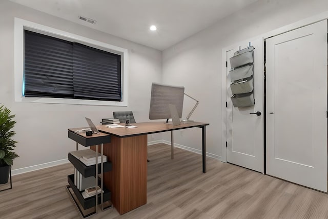 office area with hardwood / wood-style floors