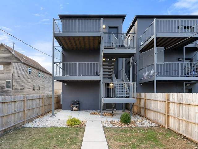 rear view of property featuring a patio area