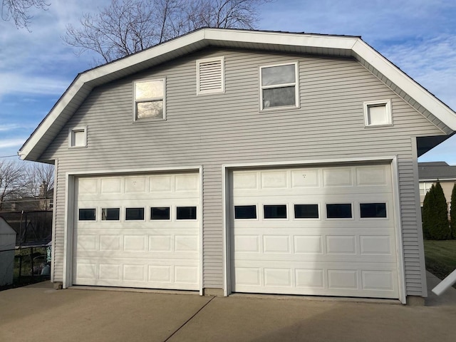 exterior space featuring an outbuilding and a garage