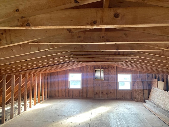 attic featuring a healthy amount of sunlight