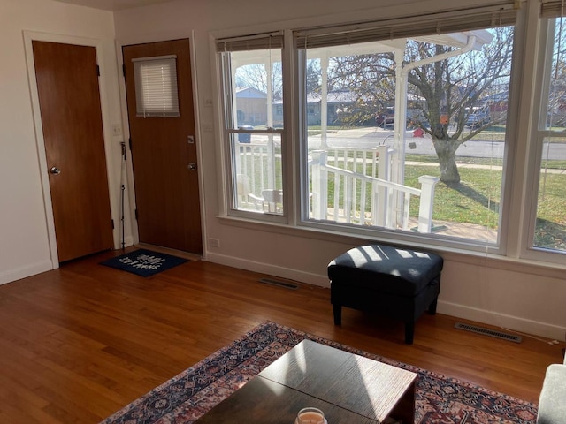 entryway with hardwood / wood-style flooring