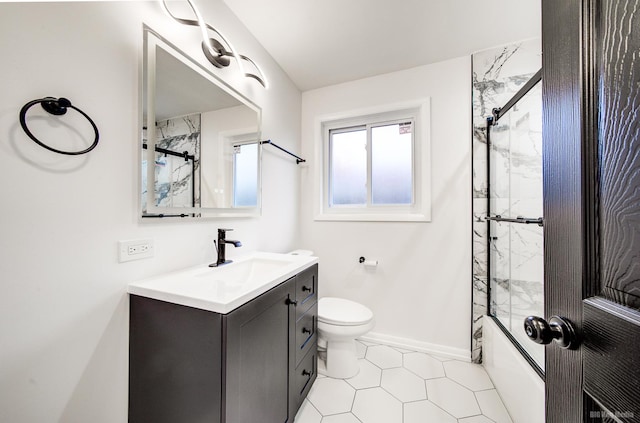 full bathroom with tile patterned floors, vanity, toilet, and enclosed tub / shower combo