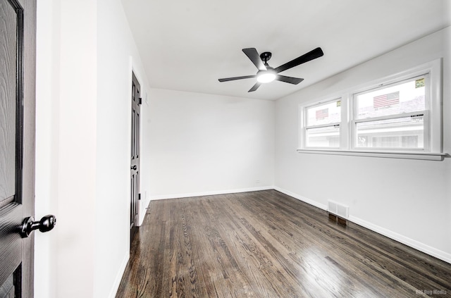 unfurnished room featuring dark hardwood / wood-style flooring and ceiling fan