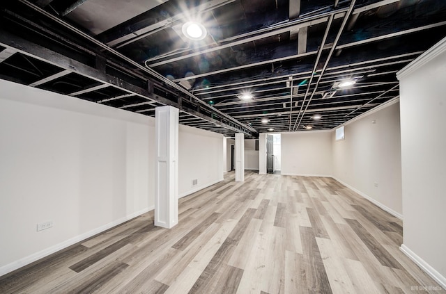 basement featuring wood-type flooring