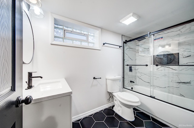 full bathroom with tile patterned flooring, vanity, enclosed tub / shower combo, and toilet