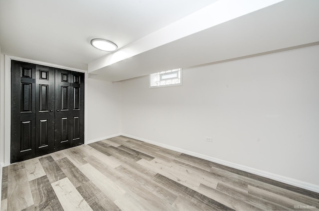 basement featuring light wood-type flooring