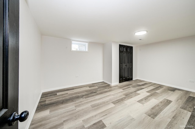 basement featuring light wood-type flooring