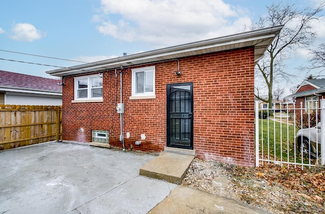 rear view of house with a patio