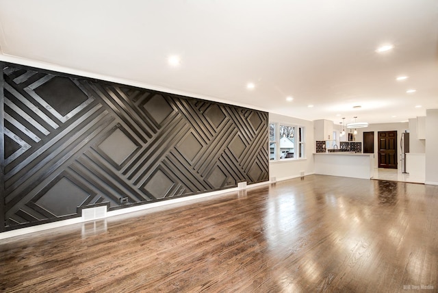 unfurnished living room with hardwood / wood-style floors