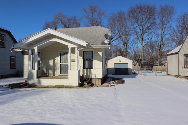 view of front facade with a garage and an outbuilding