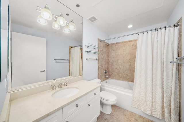 full bathroom with tile patterned floors, vanity, shower / bath combo, and toilet