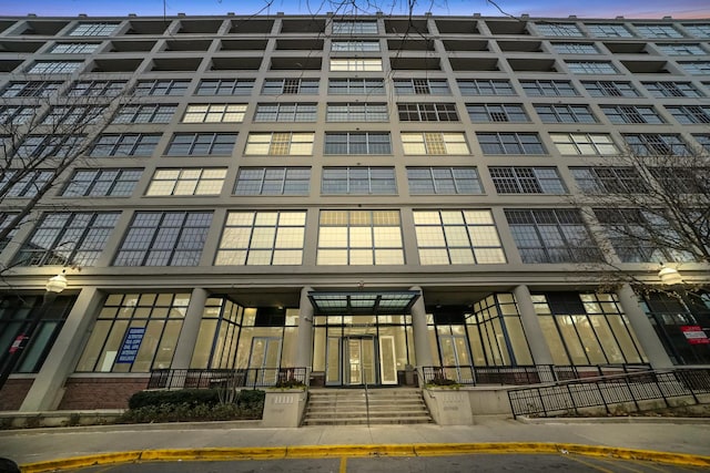 view of outdoor building at dusk