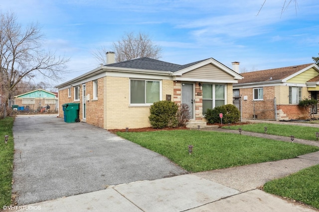 bungalow-style house with a front yard