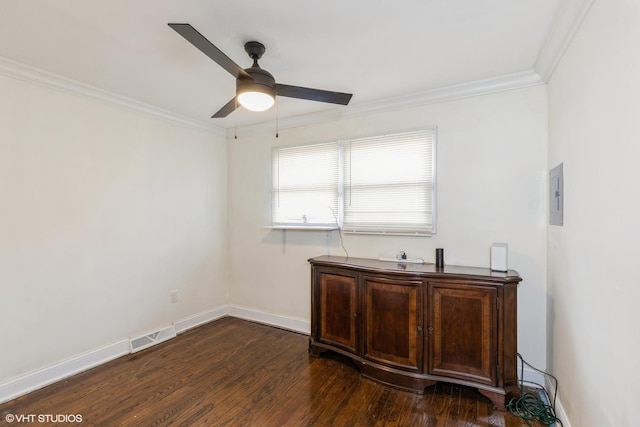 office featuring dark hardwood / wood-style floors, ceiling fan, and ornamental molding