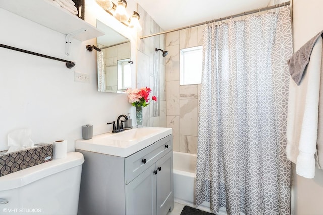 full bathroom with vanity, shower / bath combination with curtain, and toilet