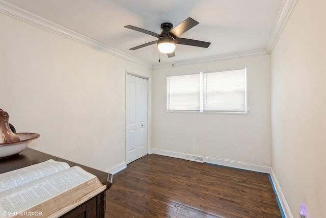 bedroom featuring ceiling fan, dark hardwood / wood-style floors, and ornamental molding