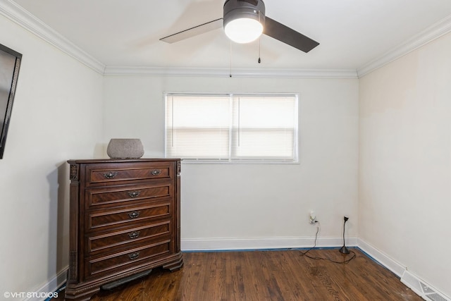 spare room with ceiling fan, dark hardwood / wood-style flooring, and crown molding