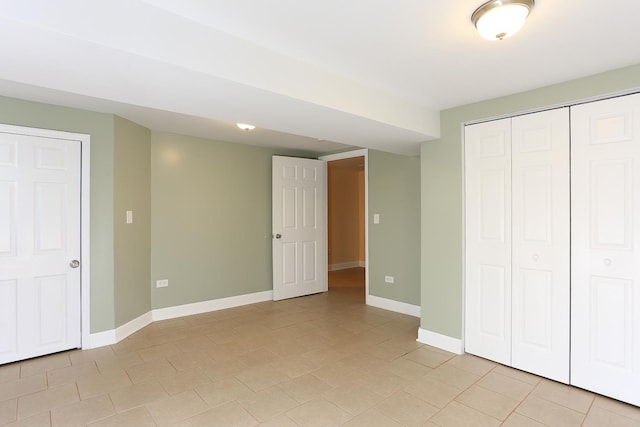 unfurnished bedroom featuring light tile patterned floors