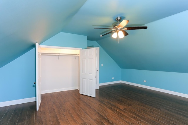 additional living space featuring ceiling fan, lofted ceiling, and dark wood-type flooring