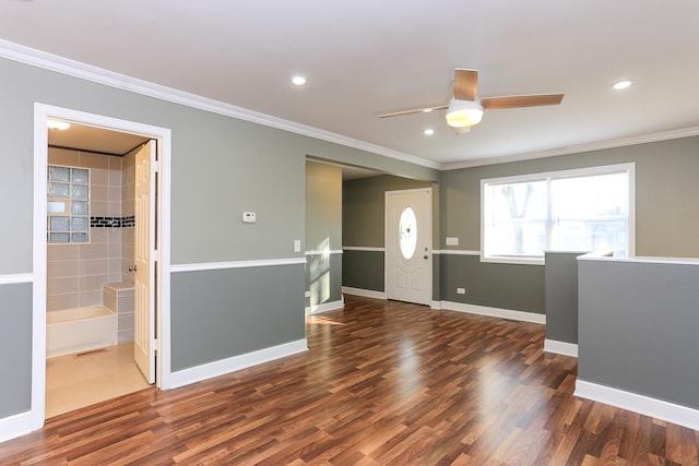 entrance foyer featuring crown molding, dark hardwood / wood-style flooring, and ceiling fan