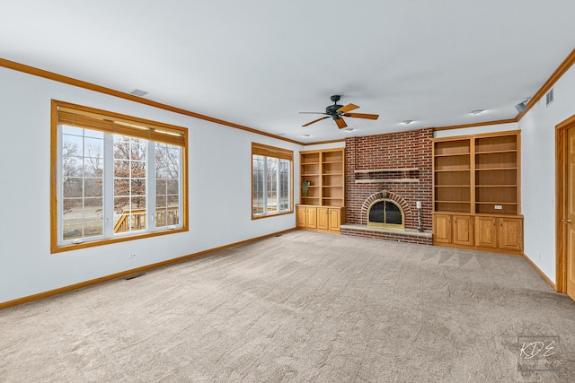 unfurnished living room with light carpet, ceiling fan, ornamental molding, and a brick fireplace