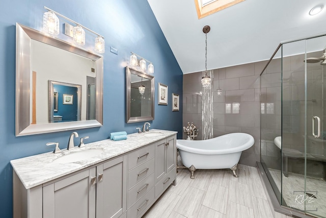 bathroom featuring vanity, lofted ceiling with skylight, and plus walk in shower