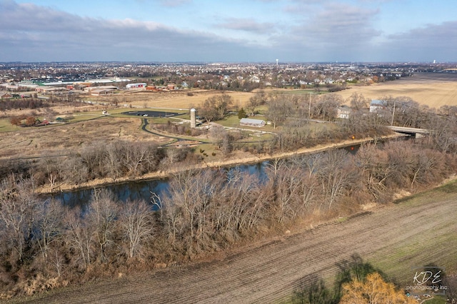 birds eye view of property featuring a rural view and a water view