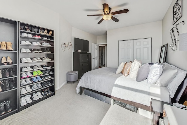 bedroom featuring carpet floors, ceiling fan, and a closet