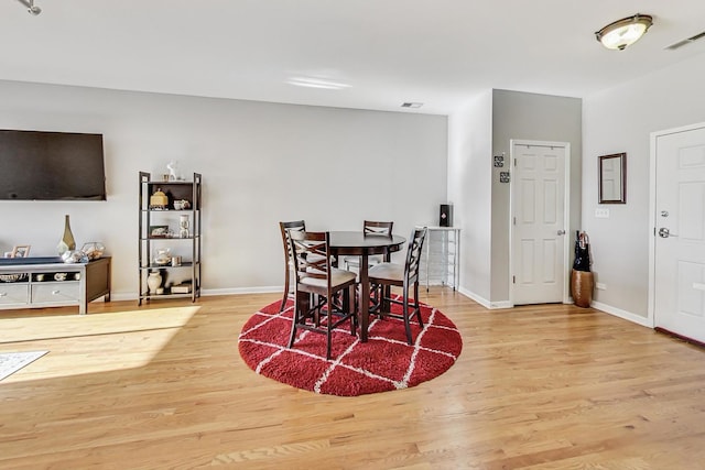 dining room with light hardwood / wood-style flooring