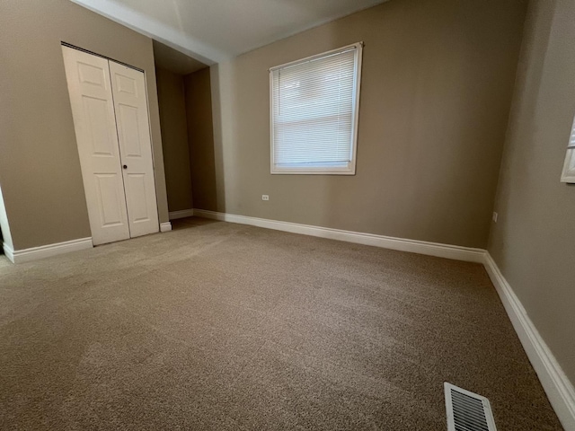 empty room featuring carpet