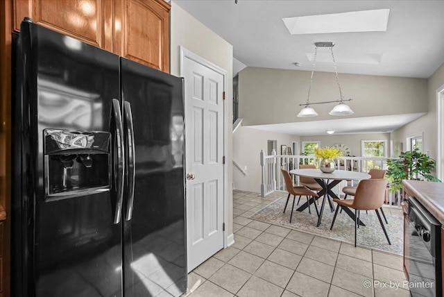 1154 Dovercliff Way, Crystal Lake, IL 60014 - kitchen with black fridge, dishwasher, brown cabinets, a skylight, and vaulted ceiling